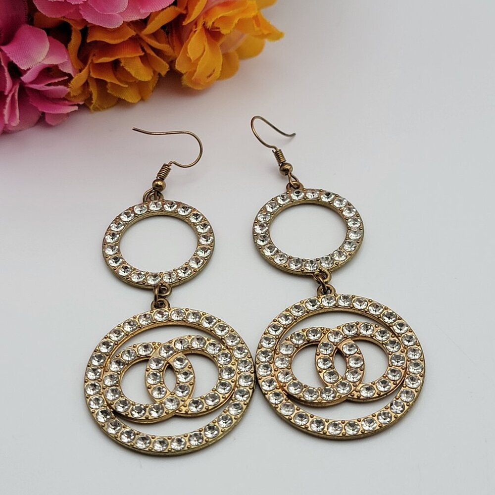 Gold Tone Clear Cubic Zirconia Interlocking Circle Dangle Hoop Earrings 2.5"